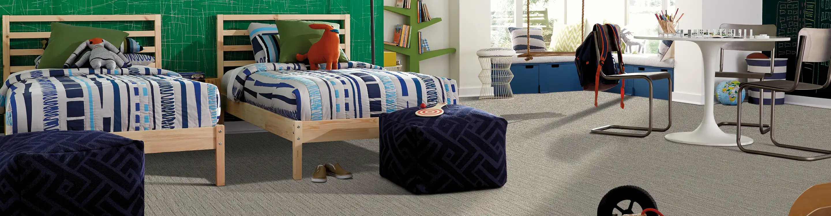 Colorful area rug with double twin beds. 